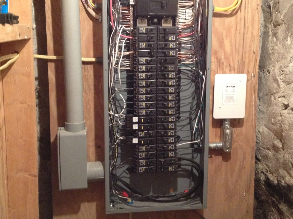 Basement electrical breaker panel with wiring
